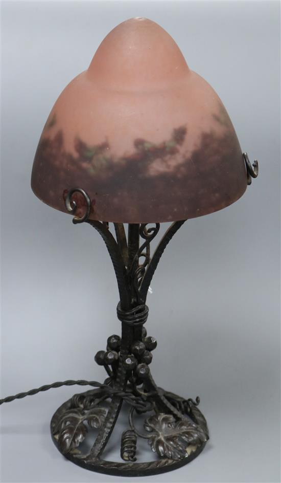 A Degue 1920s hammered wrought iron and glass shaded table lamp, signed